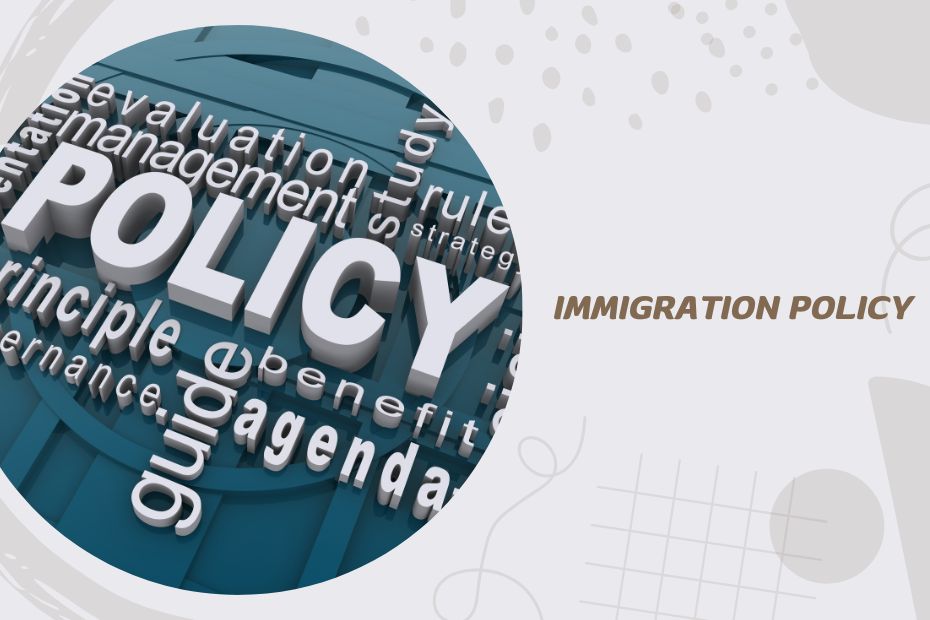 A diverse group of international students studying at a university, discussing immigration policy changes and their impact on education.